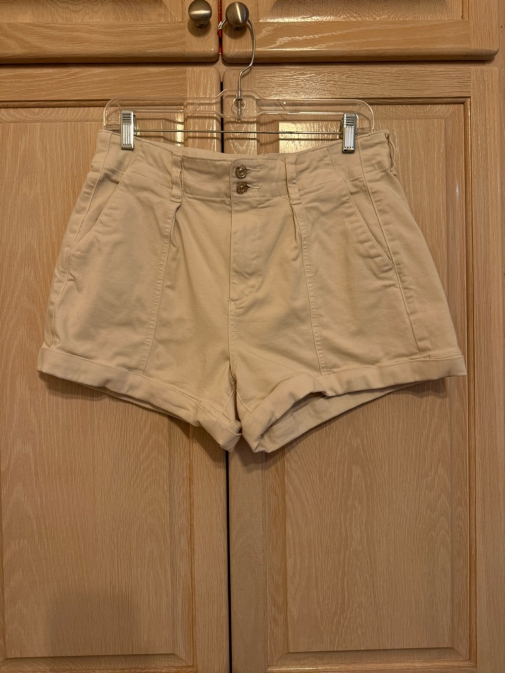PAIGE High-Waist Pleated Cream Shorts with Double Button